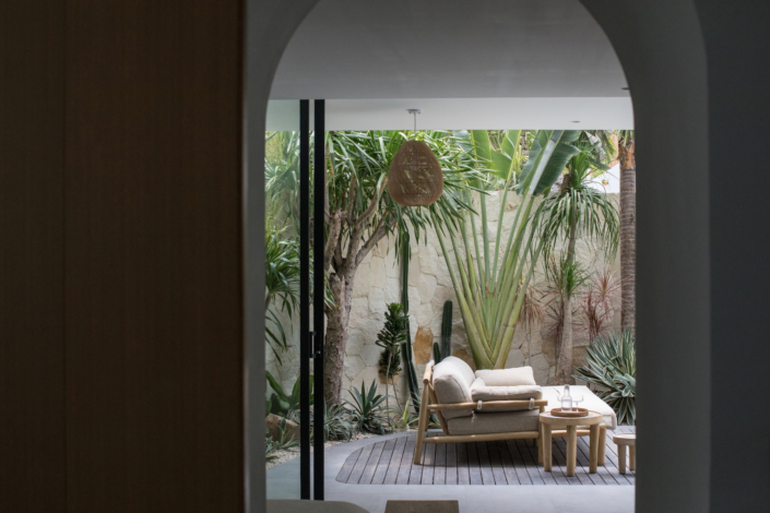 Cozy outdoor lounge with tropical plants and modern design at Jipsi Villas Canggu Bali