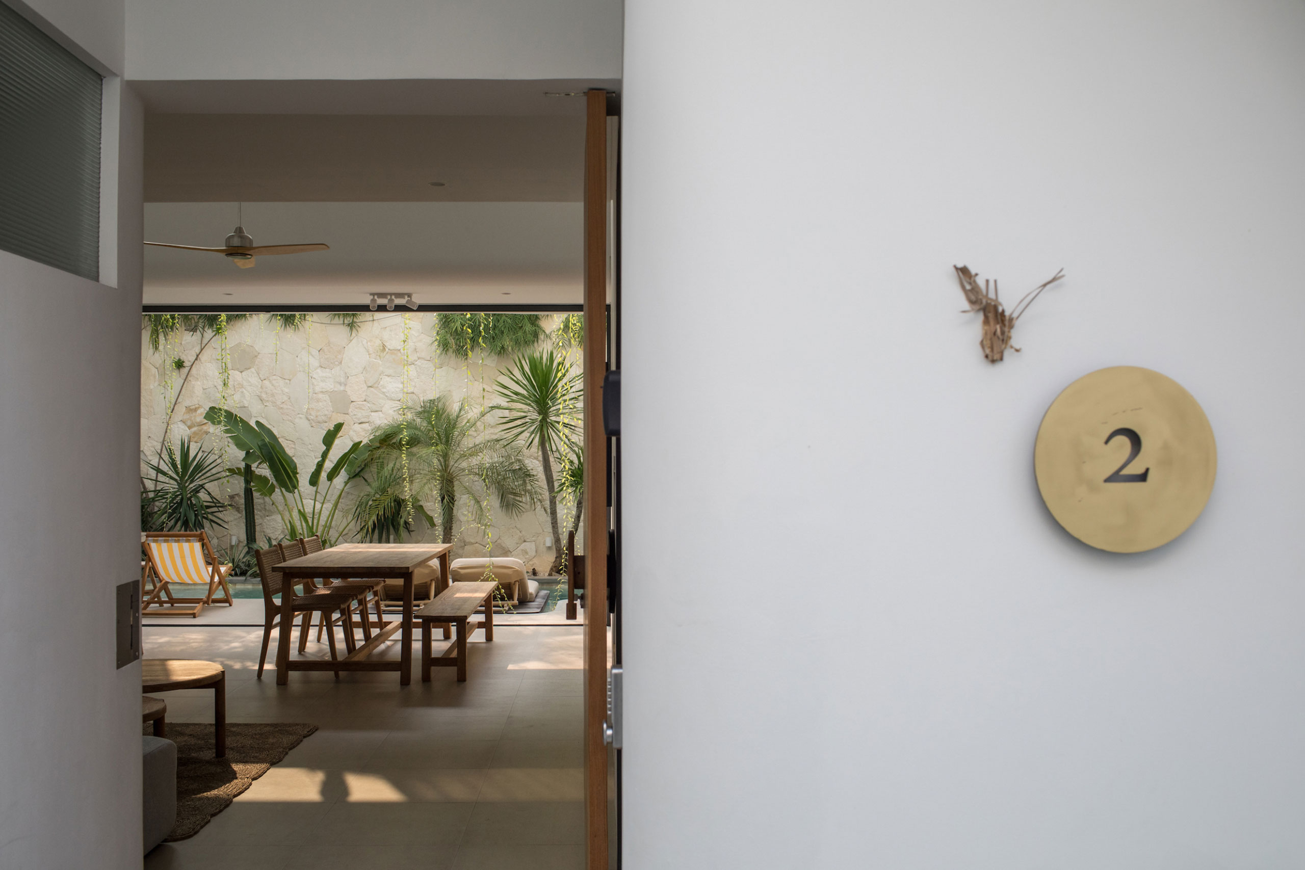 Villa entrance leading to tropical dining area at Jipsi Villas Bali