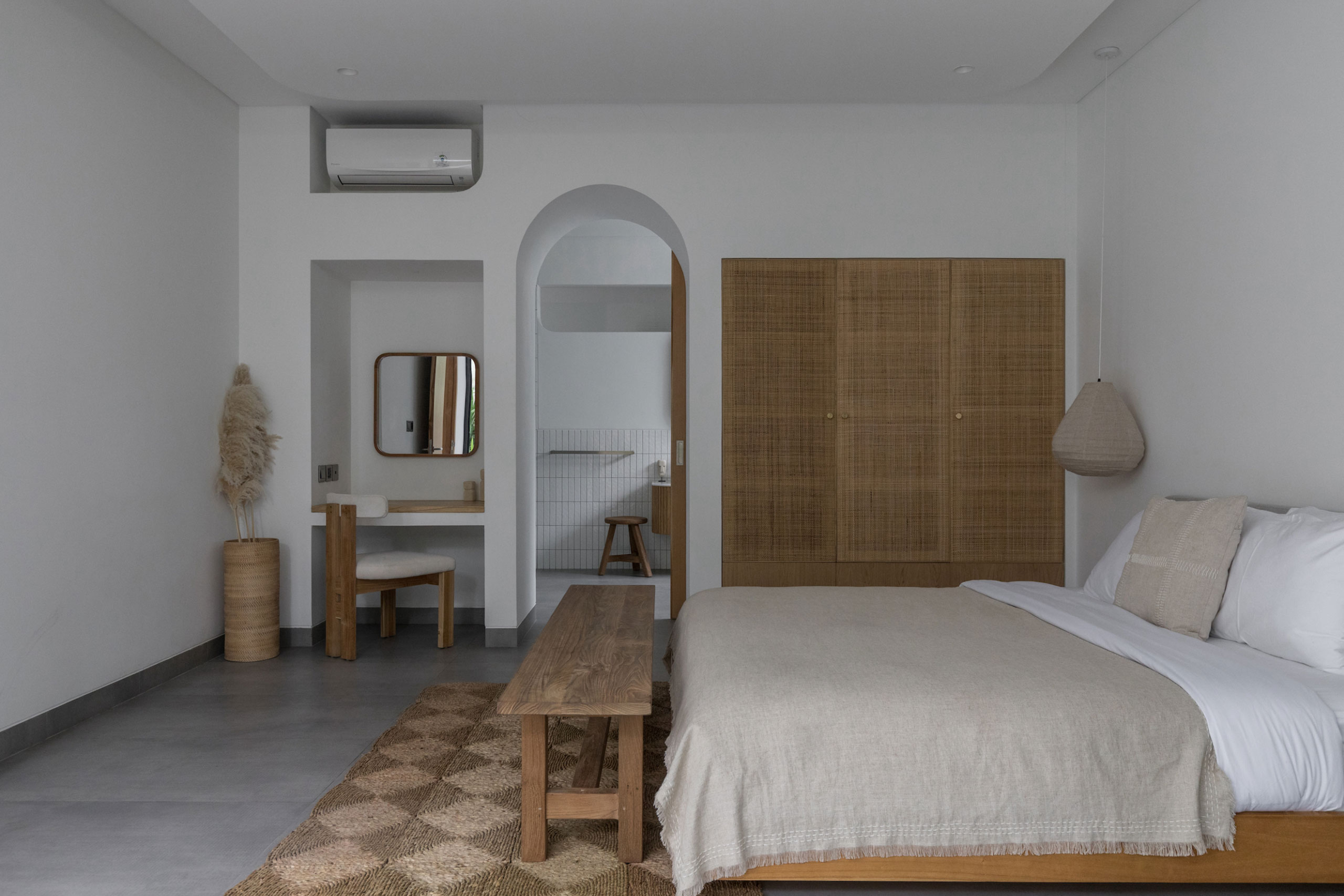 Modern bedroom with balcony and tropical garden view at Jipsi Villas Bali