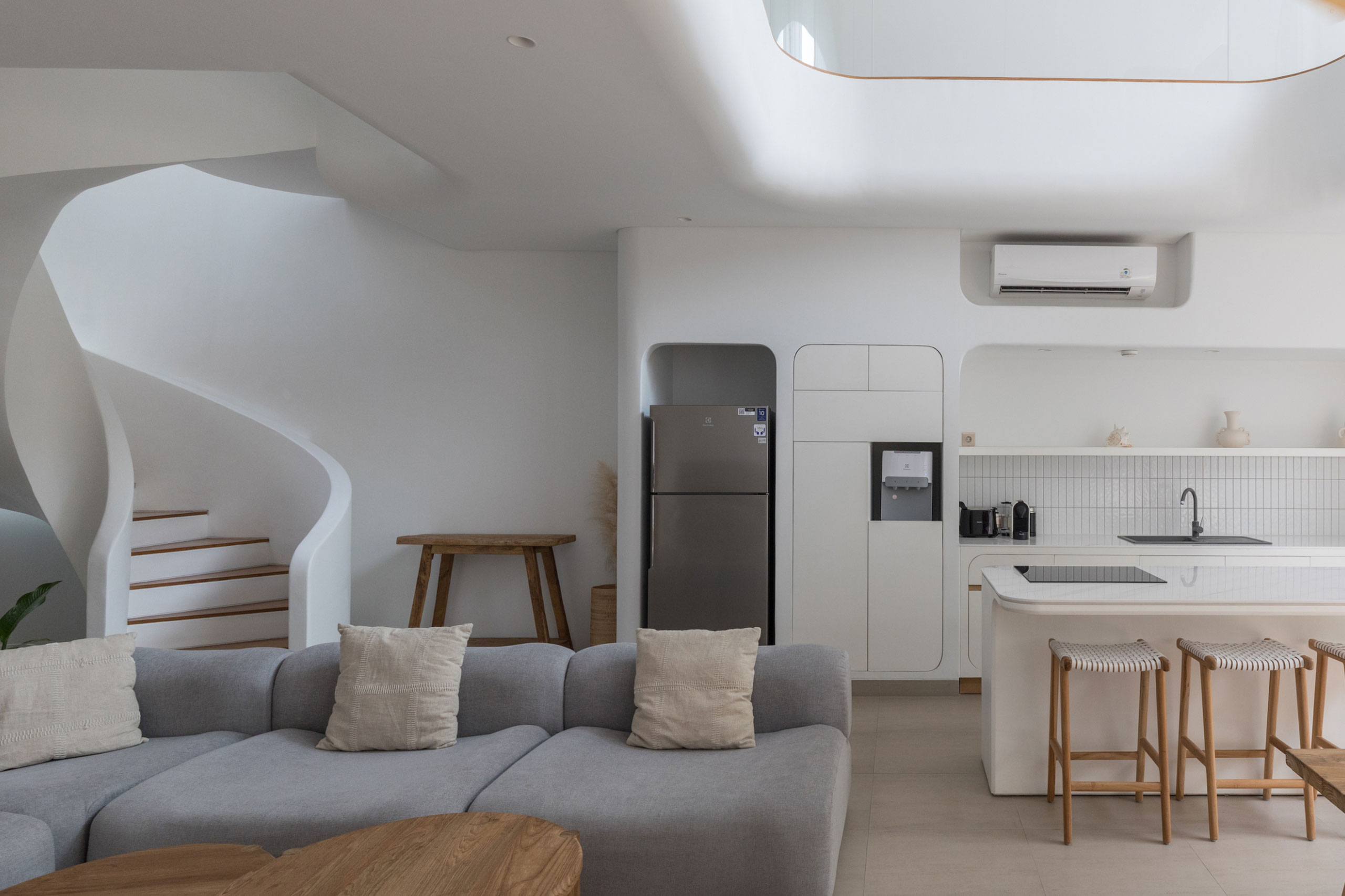 Bright modern kitchen and spiral staircase design at Jipsi Villas Bali