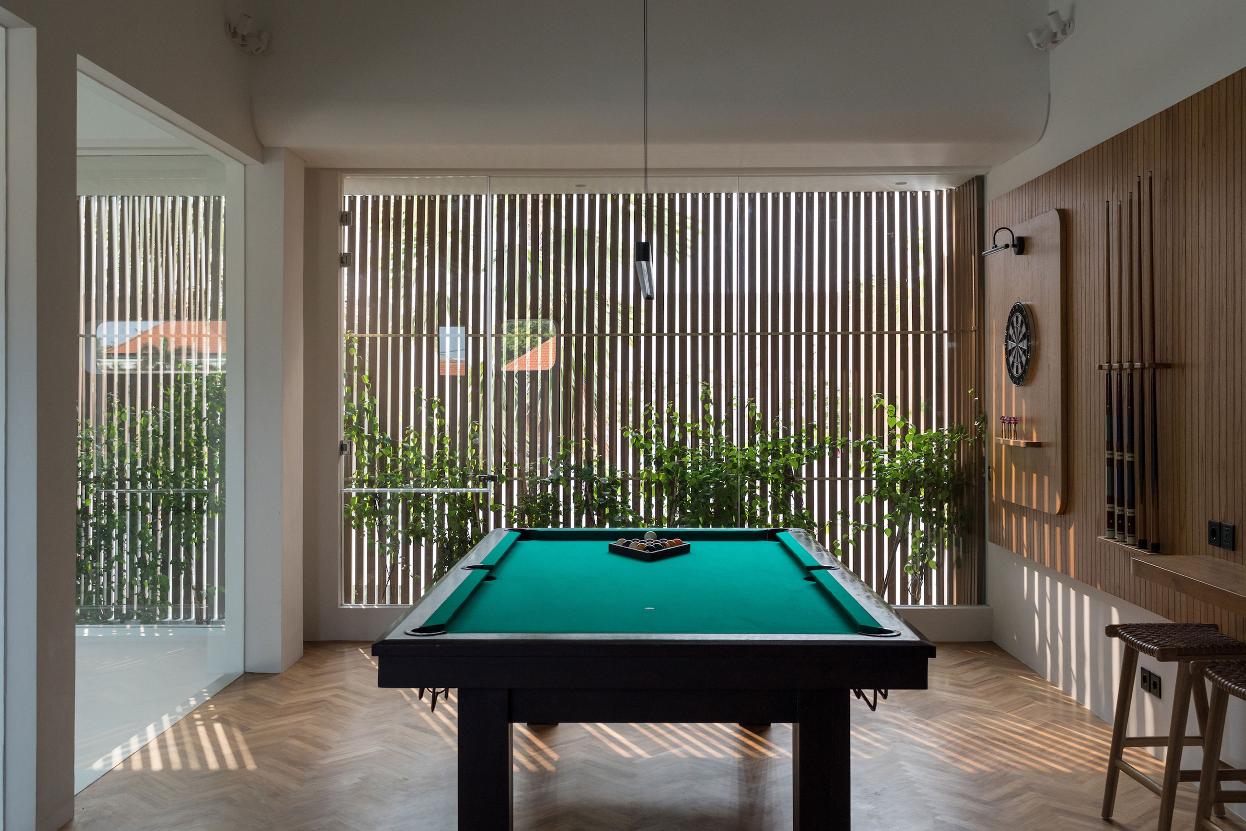 Modern recreation room with billiard and dart board at Jipsi Villas Bali
