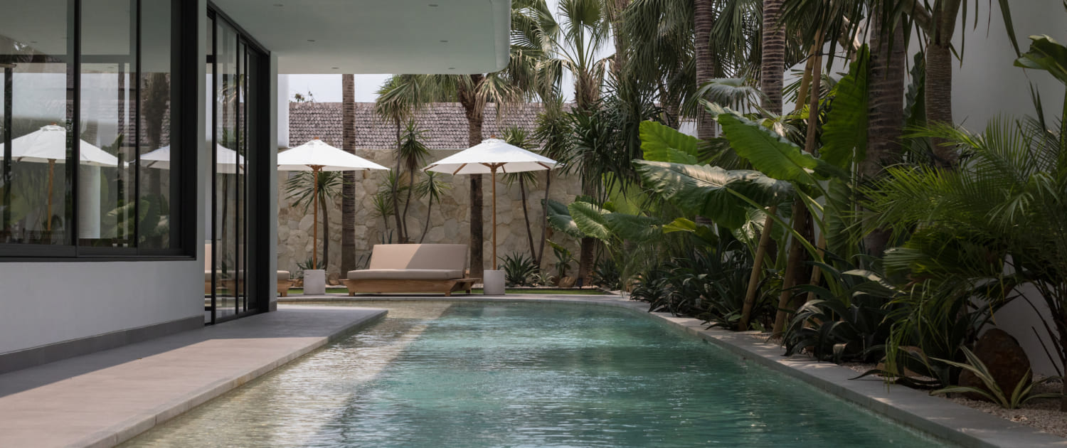 a large wrap around lap pool with a shallow